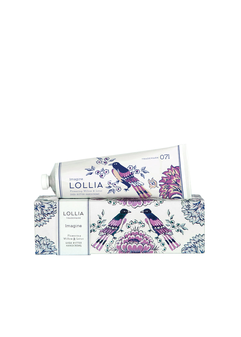 A decorative box with a Floral Willow & Lotus design, containing a tube of Margot Elena Lollia Imagine Shea Butter Hand Creme, displayed against a white background.