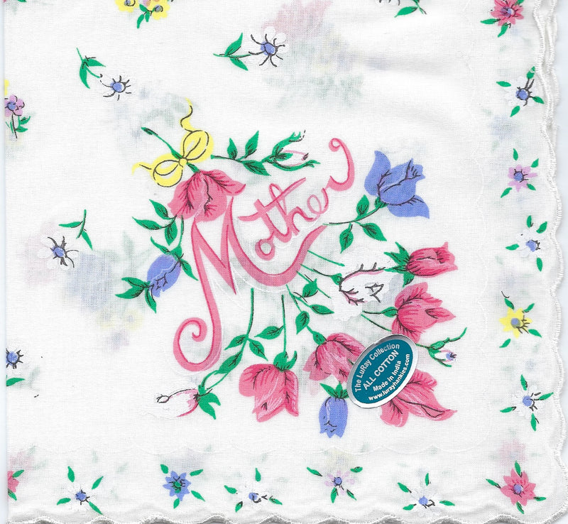 A Vintage-Inspired Hanky - Mother with Delicate Flower Border Hanky from Hankies ala Carte, a square, white pure cotton fabric with a floral design and the word "mother" in the center, surrounded by pink, purple, and blue flowers, with butterflies. "Made in the USA.