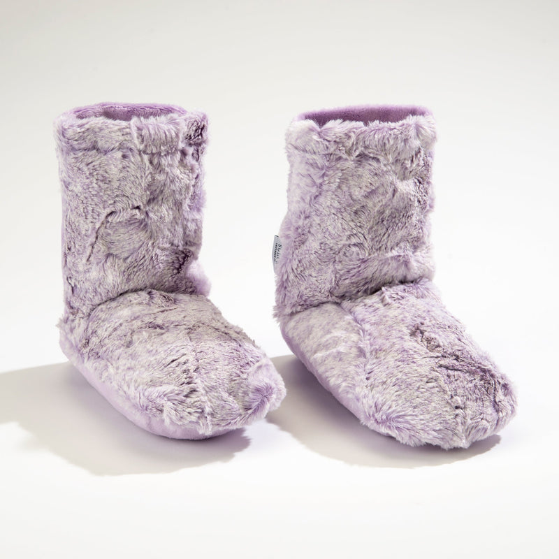 A pair of plush, Sonoma Lavender Aster Heather Spa Booties standing upright on a white surface, featuring a soft, fuzzy texture.