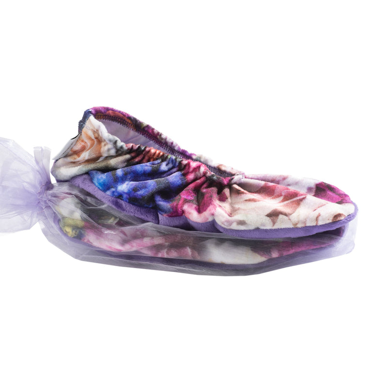 A colorful, multi-patterned Sonoma Lavender Peony Bouquet Heatable Footies, styled in various shades and tied with a light purple ribbon, featuring lavender foot balm, isolated on a white background.