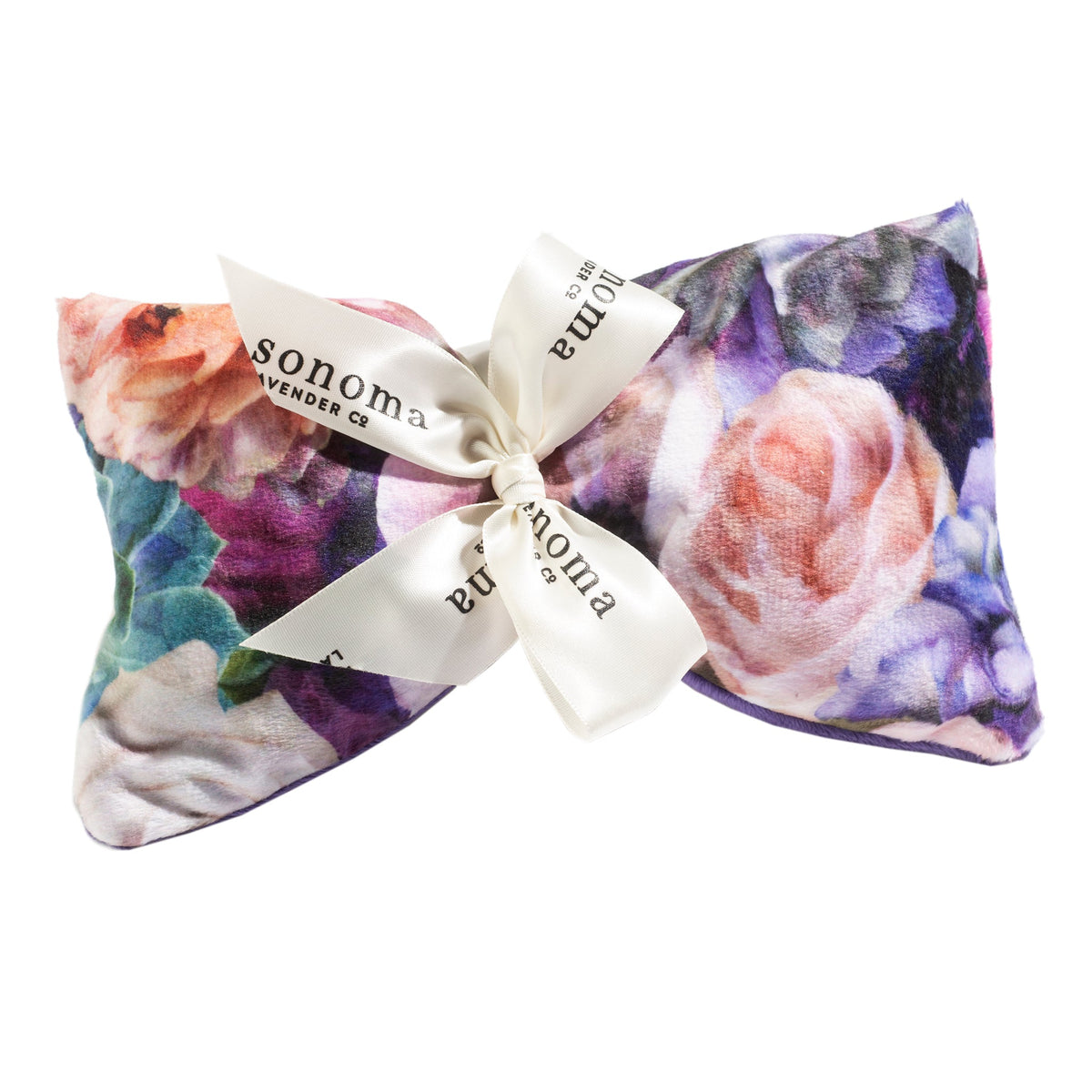 A floral-patterned aromatherapy Sonoma Lavender Peony Bouquet Spa Mask with a bow tied around it, displaying the text "Sonoma Lavender Co" on the ribbon. This heat therapy pillow features vibrant colors and a mix