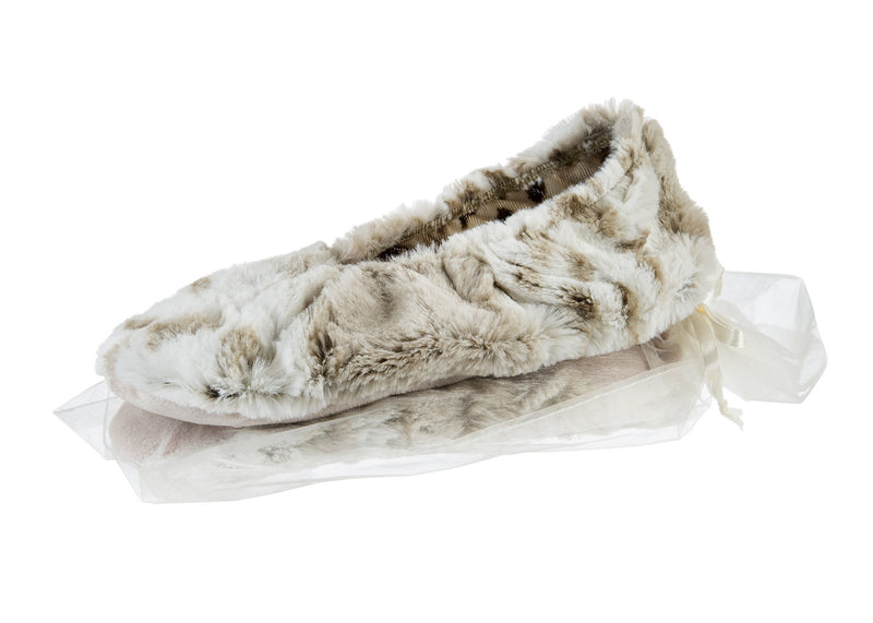 A pair of Sonoma Lavender Arctic Circle Footies Heated Footies, in plush beige and white furry material with a fluffy interior, packaged in a clear, thin plastic bag, isolated on a white background. Includes lavender foot balm.