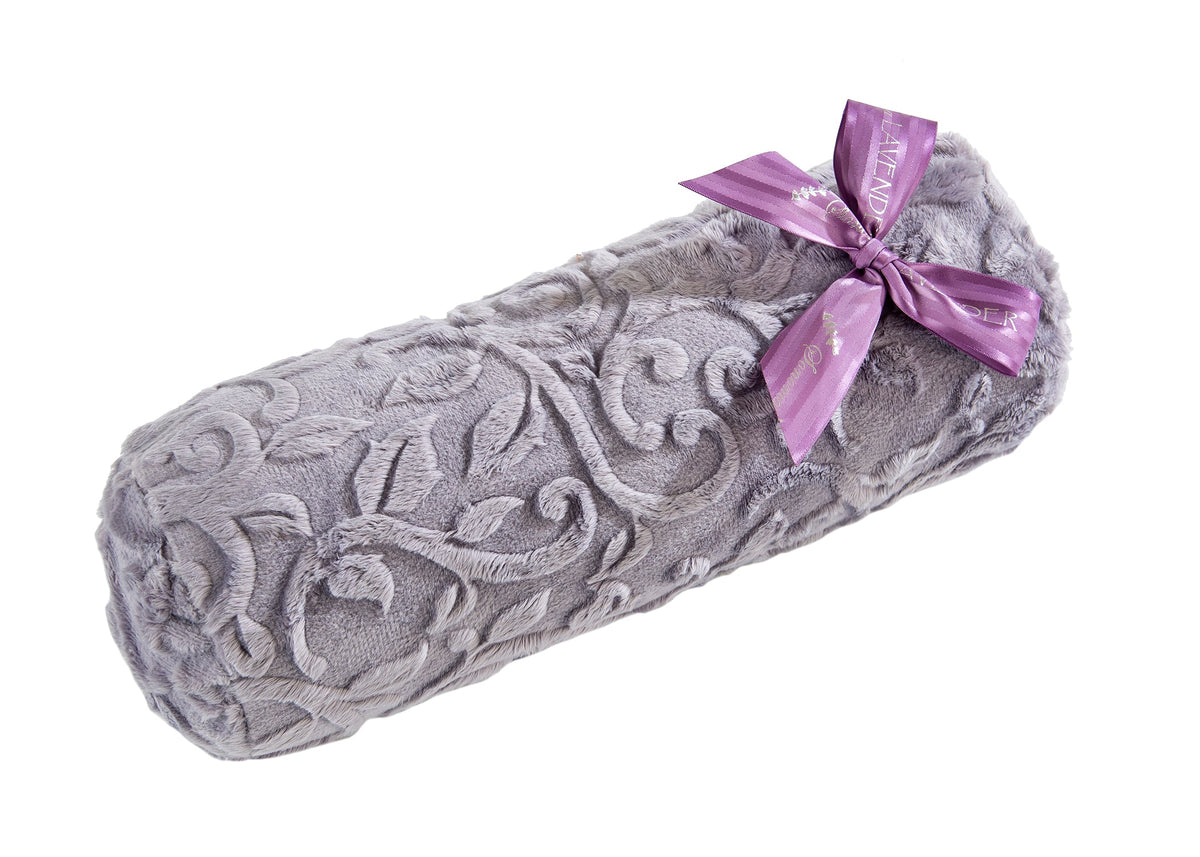 A soft, gray Sonoma Lavender plush blanket with an intricate embossed pattern, rolled up and tied with a silky aromatherapy lavender ribbon, isolated on a white background.