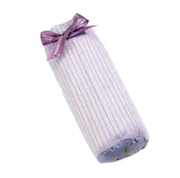 A Sonoma Lavender Embroidered Lavender Bolster Lumbar/Neck Roll rolled up and tied with a shiny purple ribbon, featuring a small lavender floral pattern and lavender flowers on the inner lining, isolated on a white background.