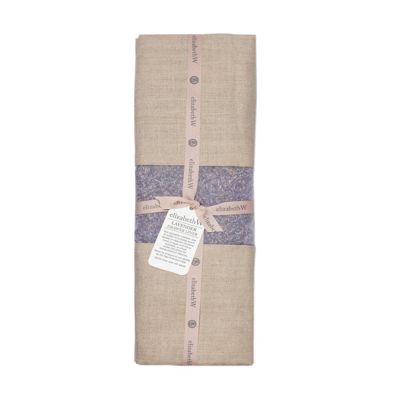 A rolled up beige linen towel wrapped with a printed blue and purple floral band and labeled tags from "elizabeth W" Lavender Linen Drawer Liner - Natural on a white background.