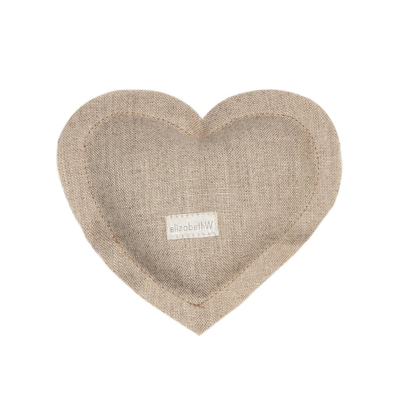 A elizabeth W Linen Heart Sachet - Natural made of 100% linen fabric featuring a small label with the text "elizabeth W" in the center. The background is plain and light-colored.