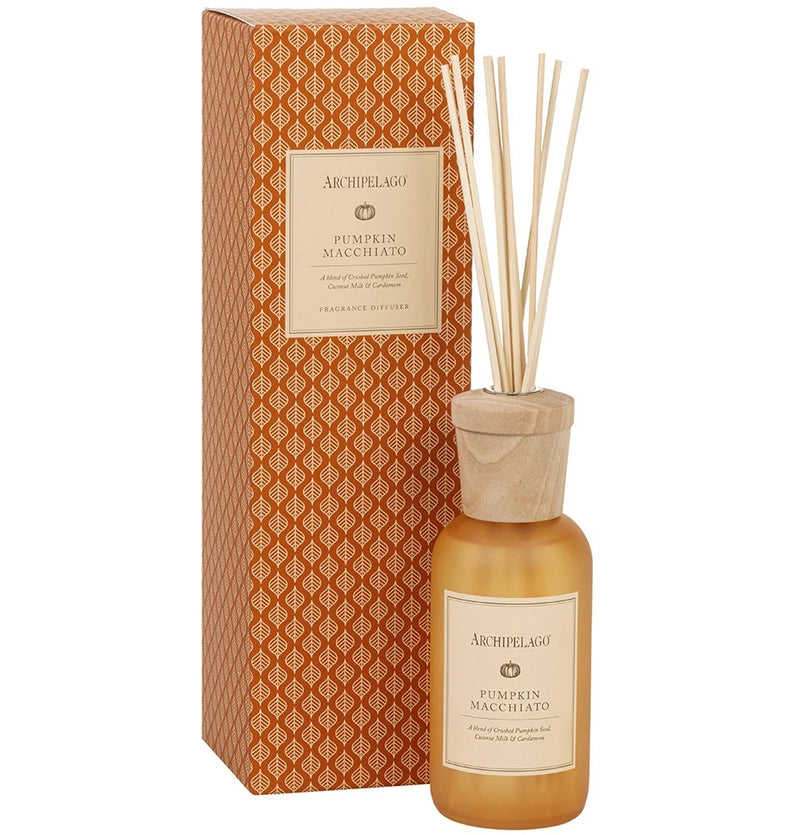 A bottle of Archipelago Botanicals Archipelago Pumpkin Macchiato Reed Diffuser - Ltd Edition infused with essential oils and reed sticks, alongside its ornate orange and white patterned packaging box.