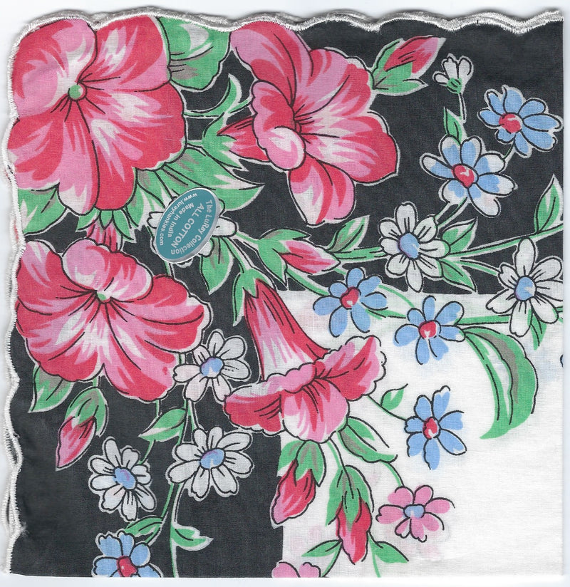 A colorful floral pattern on pure cotton fabric featuring large pink and smaller white and blue flowers with green leaves, and a blue "certified organic" label by Hankies ala Carte: Vintage-Inspired Hanky - Pink Petunias on Black Border Hanky.