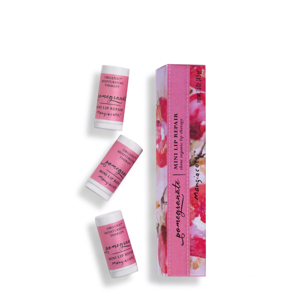 Three floral-printed Mangiacotti Pomegranate Mini Lip Repair tubes and a box, isolated on a white background. The products are labeled with organic and rejuvenating qualities.