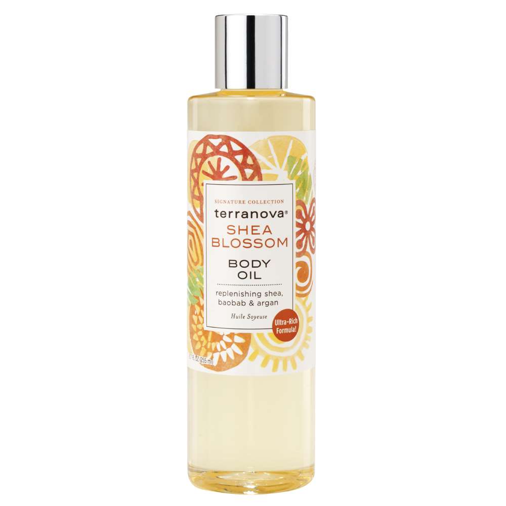 A bottle of Terra Nova Shea Blossom Body Oil With Shea, Baobab And Argan Oils, featuring a clear container with a vibrant label depicting orange and green floral motifs, enriched with Shea oil for dry skin, and text detailing the product’s