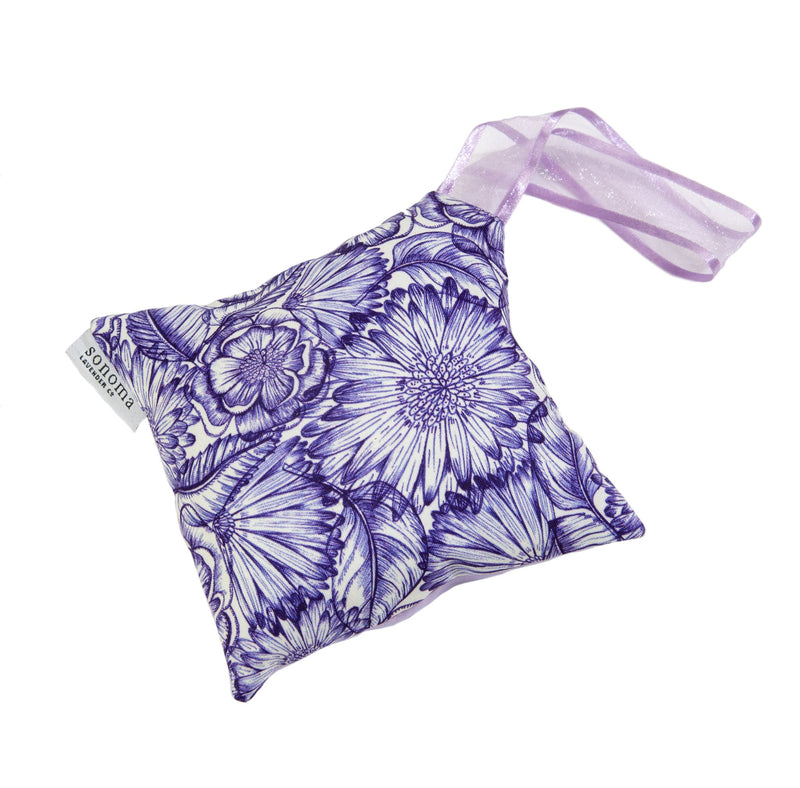 A Sonoma Lavender 6" Hanging Sachet with Tassel in Purple Bouquet floral patterned sachet with a silky ribbon on a white background.