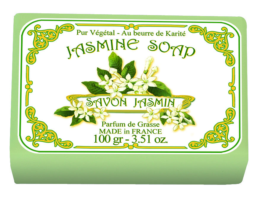 A square, green package of Le Blanc Jasmine Wrapped Soap, labeled in both English and French, adorned with illustrations of jasmine flowers and leaves, highlighting its shea butter content and Le Blanc Made in France origin.