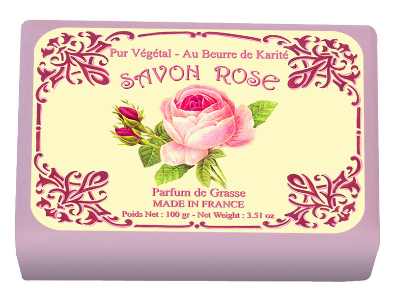A rectangular bar of Le Blanc Rose Wrapped Soap with ornate purple packaging that includes floral motifs and a pink rose illustration. The text on the label includes "savon rose," "made in France.