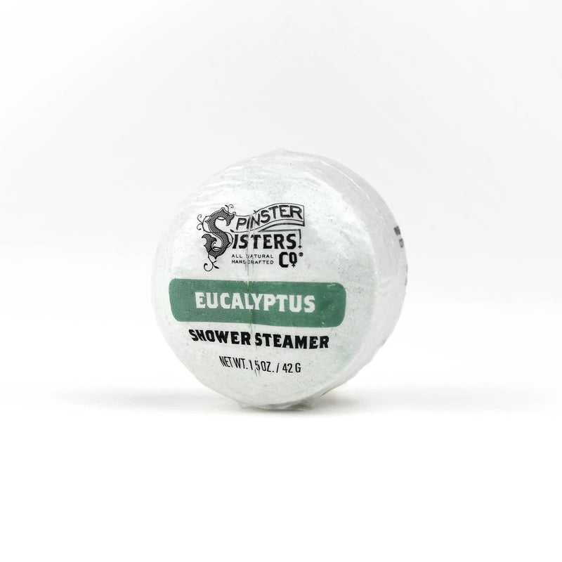 A Spinster Sisters Eucalyptus Shower Steamer by Spinster Sisters Co., displayed against a plain white background with visible product details and branding.