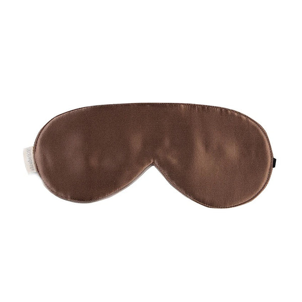 The elizabeth W Silk Sleep Mask - Cocoa is a brown satin silk mask that ensures restful sleep with its smooth texture and eye coverage. Ideal for San Francisco Bay area residents, it boasts an elastic strap for comfort.