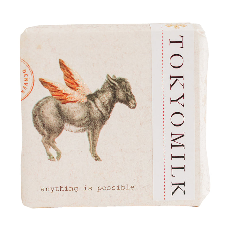 A soap bar packaging featuring a whimsical illustration of a winged donkey, with the phrase "anything is possible" and the phrase "Margot Elena TokyoMilk Finest Perfumed Soap" displayed prominently on the