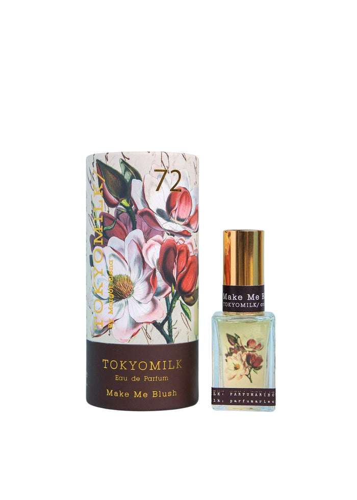 A Margot Elena TokyoMilk Make Me Blush No. 72 Parfum set featuring an ornate, sugared floral-designed cylindrical package labeled "make me blush" alongside a matching rectangular perfume bottle with similar floral motifs.
