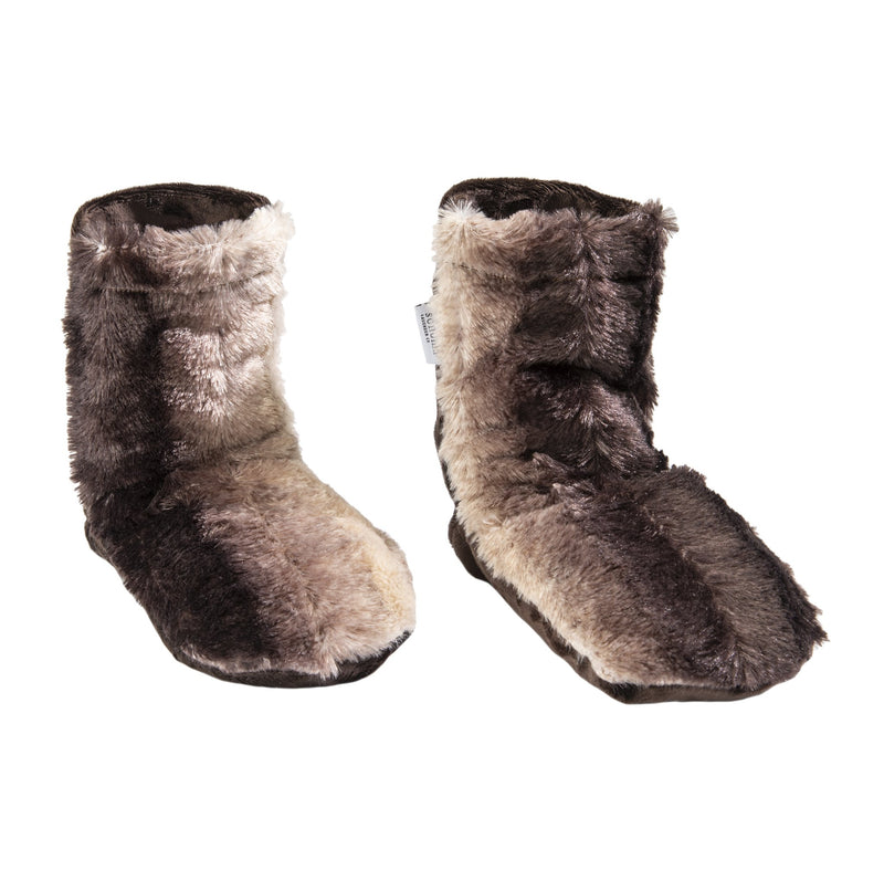 A pair of Sonoma Lavender Sonoma Timber Lake Chinchilla Spa Booties, fluffy, brown and beige faux fur boots isolated on a white background.