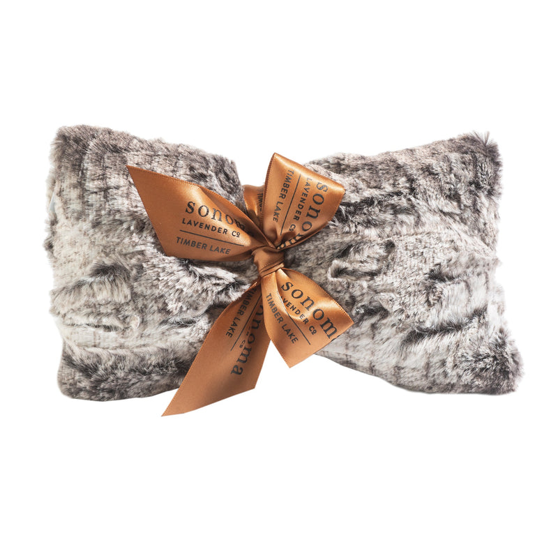 A plush gray throw blanket tied with a golden orange bow featuring the text "Sonoma Timber Lake Winter Frost Spa Mask" on a white background.
