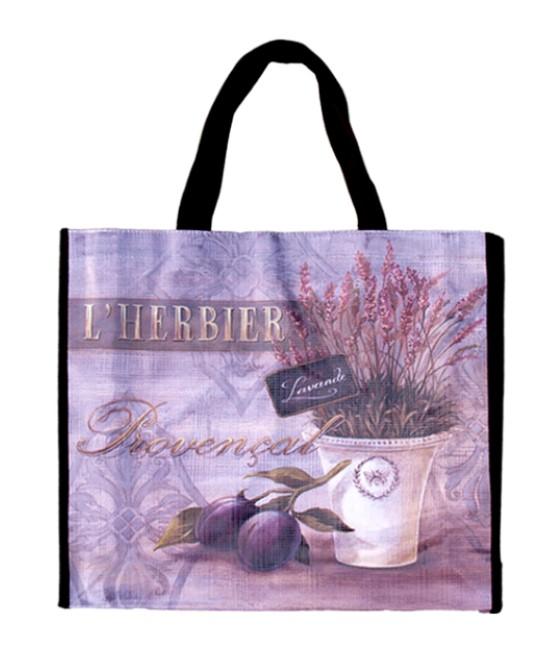 Replace with: A Shopping Bag - Herbier featuring a printed design of a potted lavender plant and scattered figs with the text "l'herbier provençal lavande" superimposed over a subtle gray floral by Mierco.