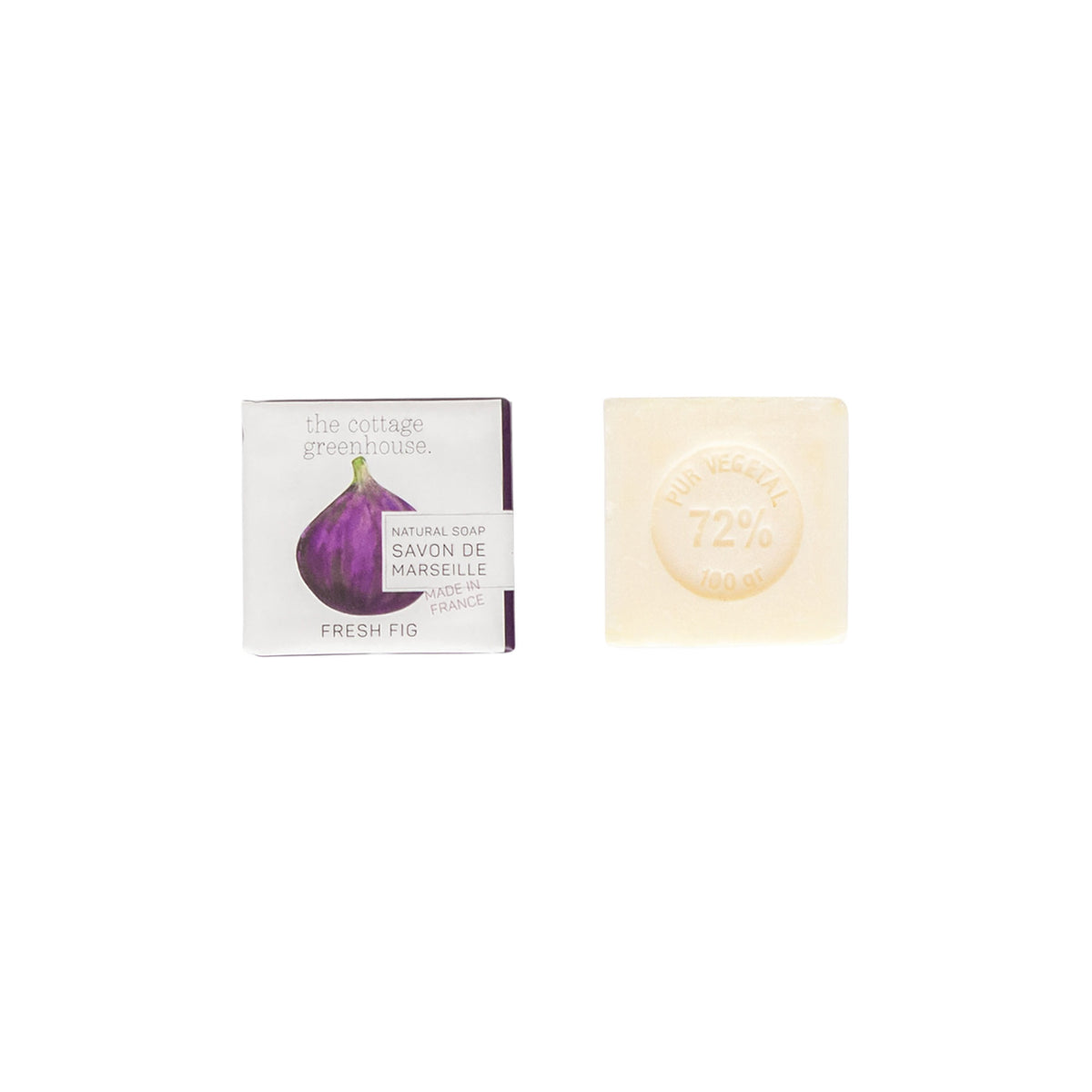 A bar of The Cottage Greenhouse Fresh Fig Soap and its packaging with a purple fig design. The soap is translucent and stamped with "le vegetal 72% 100g". The package reads "Margot Elena".