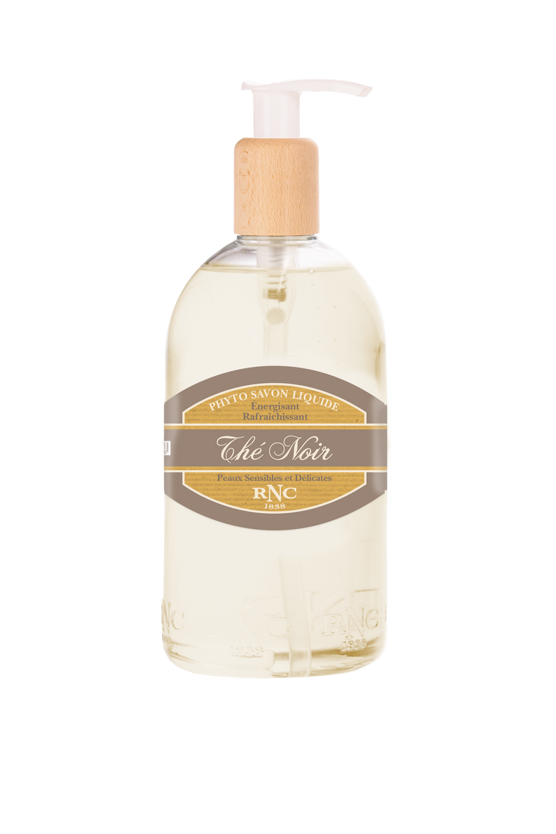 A transparent bottle of Rancé Liquid Soap - The Noir (Black Tea) hand soap with a pump dispenser, labeled "phyto savon liquide rafraîchissant the noir," on a white background.