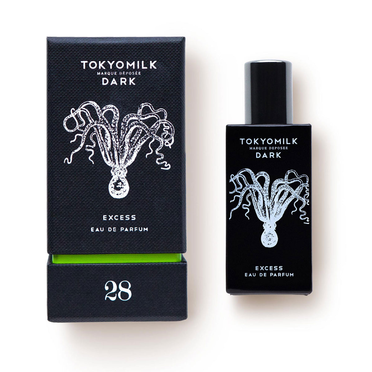 A black and white image of Margot Elena's TokyoMilk Dark Excess No. 28 Eau de Parfum packaging and bottle, both featuring a stylized jellyfish design. The text includes the brand and product name "Excess Eau de Parfum.