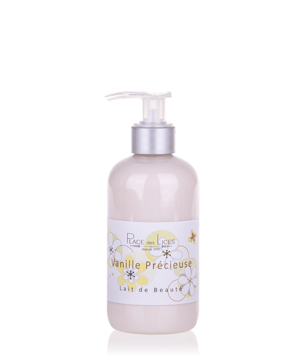 Clear plastic bottle with pump containing beauty lotion labeled "Place des Lices Vanille Précieuse Body Lotion" by Place des Lices, enriched with shea butter and decorated with pastel floral motifs.