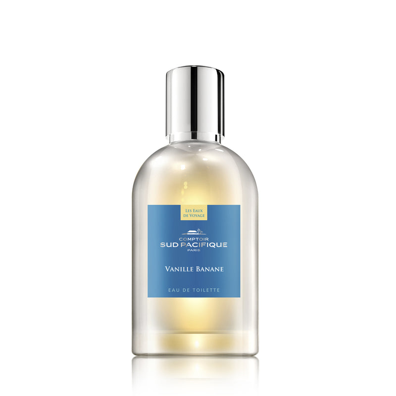 A bottle of Comptoir Sud Pacifique Paris Vanille Banane EDT with a clear glass body, a silver cap, and a blue and yellow label featuring tropical banana trees on a white background.
