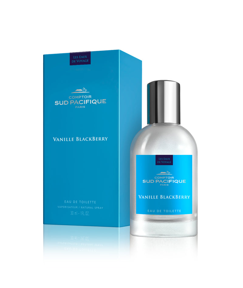 A bottle of "Comptoir Sud Pacifique Paris Vanille Blackberry EDT" by Comptoir Sud Pacifique Paris next to its blue packaging box. The bottle is transparent with a silver cap and a vanilla scent.