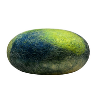 A textured, oval stone with a detailed gradient of colors, ranging from vivid blue to green and yellow, resembling a miniature, fuzzy planet infused with Fiat Luxe - Verbena Felted Soap.