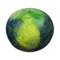 A round, textured Fiat Luxe Verbena Felted Soap with a gradient of green and blue colors, resembling handmade soap or a marbled ball, isolated on a white background.