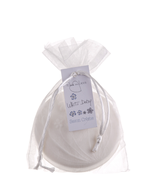 An elegant white organza drawstring bag containing a Place des Lices White Daisy Soap in Tartalane Sachet, attached with a gray ribbon and decorative tag.