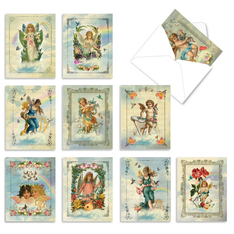 A collection of Victorian-style All Occasion Boxed Note Cards - Angelic Notes from The Best Card Co. featuring artistic depictions of angels, cherubs, and children in various settings, some with floral accents and others with ethereal backdrops.