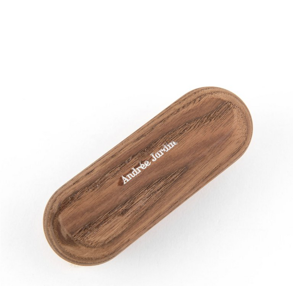 Oval wooden tray with the name "Andrea Johnson" engraved in the center, made from thermo-treated ash wood, isolated on a white background. (Andrée Jardin Heritage Ash Nail Brush) by Andrée Jardin
