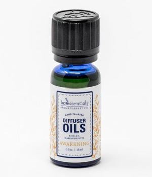 A small bottle of "BC Essentials - Diffuser Oil - Awakening" by BC Essentials, featuring Grapefruit Essential Oil, with a green-tinted glass and a black cap, against