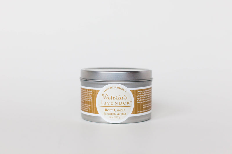 A silver tin labeled "Victoria's Lavender - Vanilla Lavender  Moisturizing Body Candle" against a plain white background. This moisturizing skin treatment is placed centrally with clear, visible text.