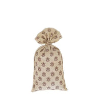 A beige drawstring bag with a La Lavande lavender pattern, tied at the top, displayed against a white background.