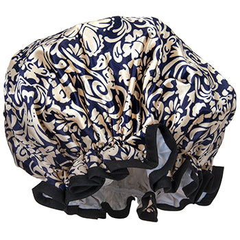 A stylish Fancy Shower Cap with a floral navy blue and white toile pattern, featuring an elastic black trim for secure fitting by Shower Caps.