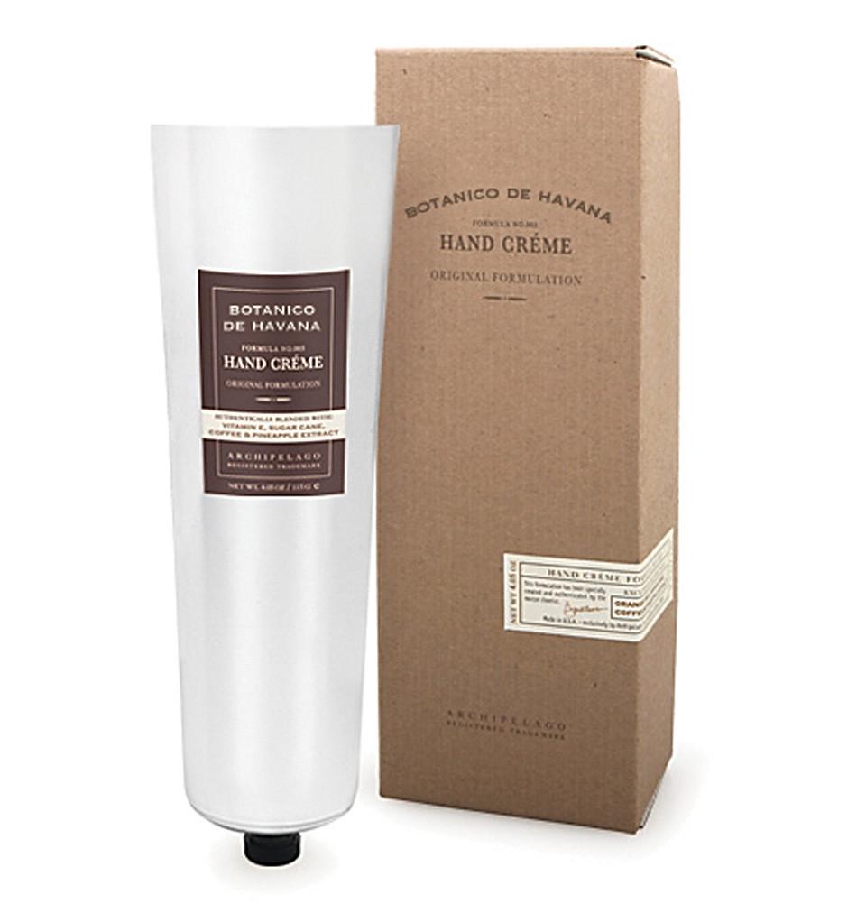 A tube of Archipelago Botanico de Havana Hand Creme by Archipelago Botanicals next to its brown cardboard packaging box with product information on it. The tube is predominantly white with elegant labeling.