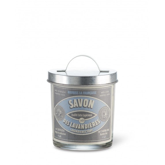 A cylindrical metallic container with a handle labeled 'Bougies la Francaise Artisan Lavandières Soap Candle w/Galvanized Lid' in vintage typography. The background is white, emphasizing the candle's simplistic yet elegant design.