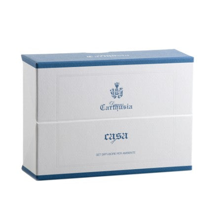 A rectangular white Carthusia Home Diffuser Set box with a blue border and the brand name "Carthusia I Profumi de Capri" printed in blue at the top and "casa" at the bottom, suggesting it contains a home