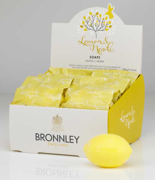 A box of luxurious Bronnley English Soaps Lemon & Neroli Soap Set with one yellow, lemon-shaped soap beside it, against a white background.