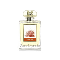 A transparent perfume bottle with a rectangular shape and a faceted cap, featuring a label with an image of red coral and the word "Carthusia Corallium Eau de Parfum - 100ml" on a white background by Carthusia I Profumi de Capri.