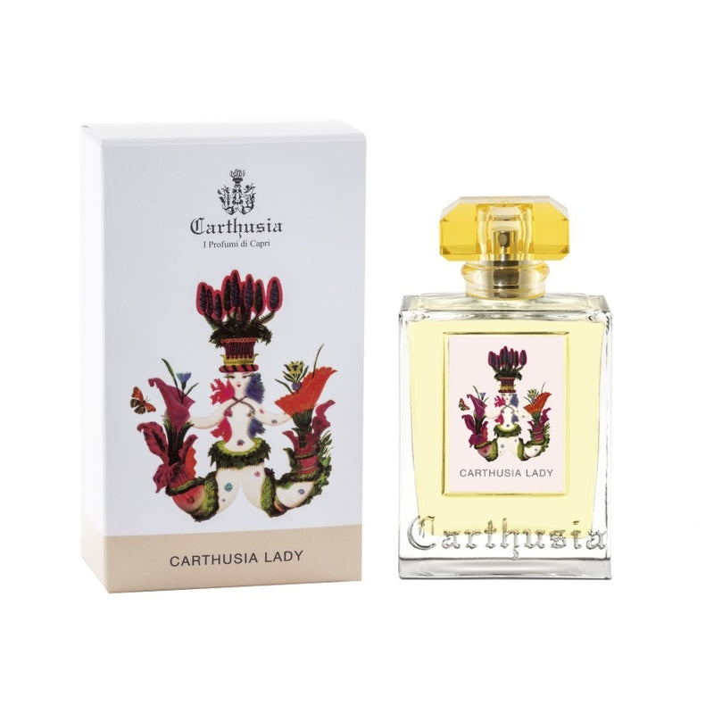 A Carthusia I Profumi de Capri perfume bottle labeled "Carthusia Lady Eau de Parfum - 100ml" next to its white packaging box adorned with colorful floral graphics and a crown motif on top, encapsulating a floral chypre fragrance.