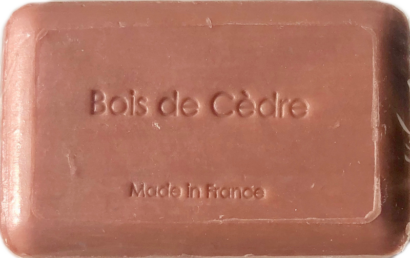 A bar of La Lavande Cedarwood Soap - 250gm, with the words "bois de cèdre" and "made in france" embossed on its surface, indicating it is cedarwood scented