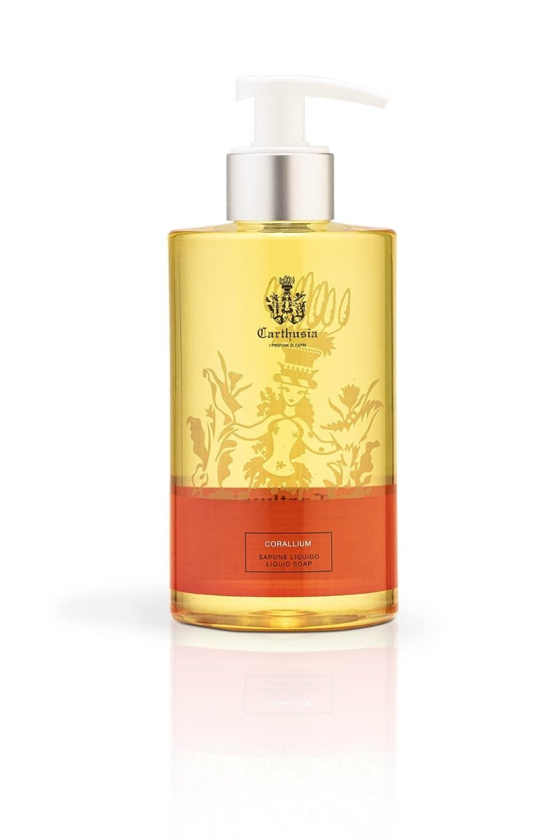 A bottle of Carthusia I Profumi de Capri brand Corallium Liquid Soap with a pump dispenser, featuring a vibrant yellow to red gradient and elegant label design with decorative elements. This luxurious lather soap is part of the Corallis collection.
