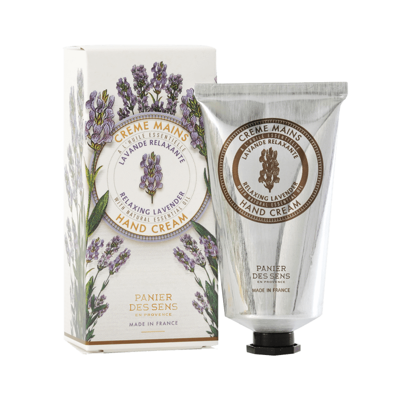 A tube of "Panier Des Sens Lavender Hand Cream" next to its packaging box, both featuring elegant lavender illustrations and labeled in French and English, indicating it's made in France by Panier Des Sens.