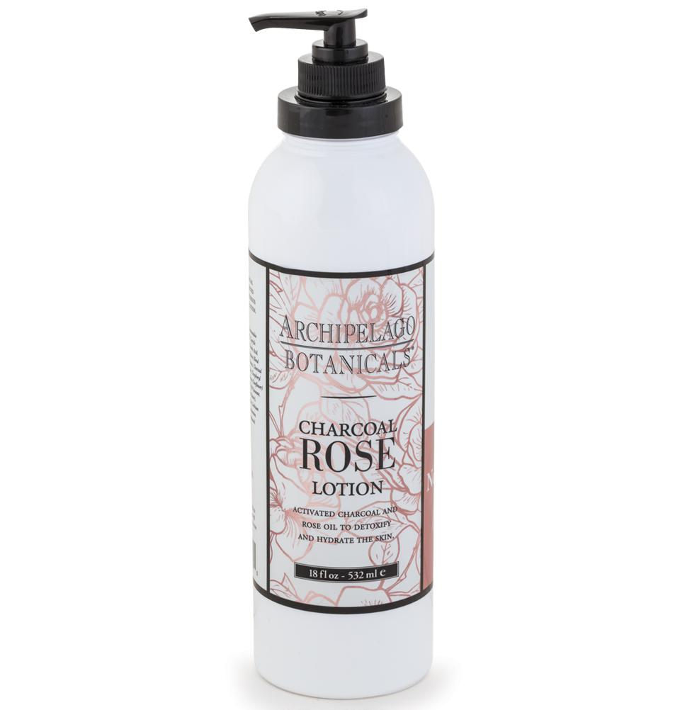 A dispenser bottle of Archipelago Charcoal Rose Lotion with rose extracts, featuring an elegant floral design on the label, positioned against a white background.