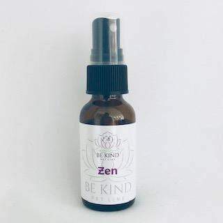 A small glass spray bottle labeled "Be Kind Pet Line - Zen: Anxiety Relief for Dogs and Cats" on a plain white background. The bottle has a dark blue spray head and features a decorative lotus design on